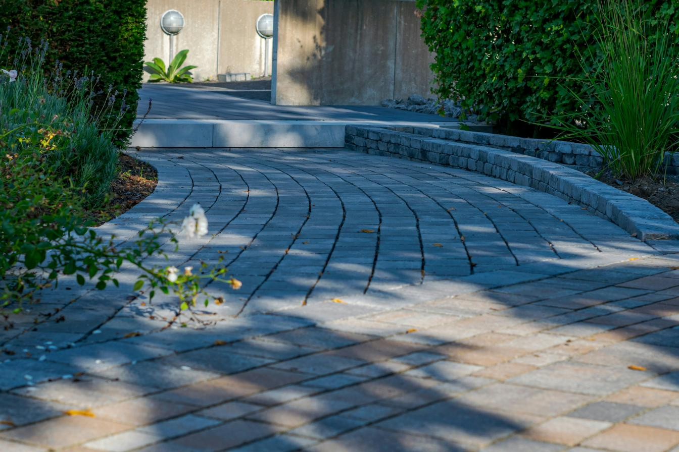 Ornamental grasses along a stone garden path